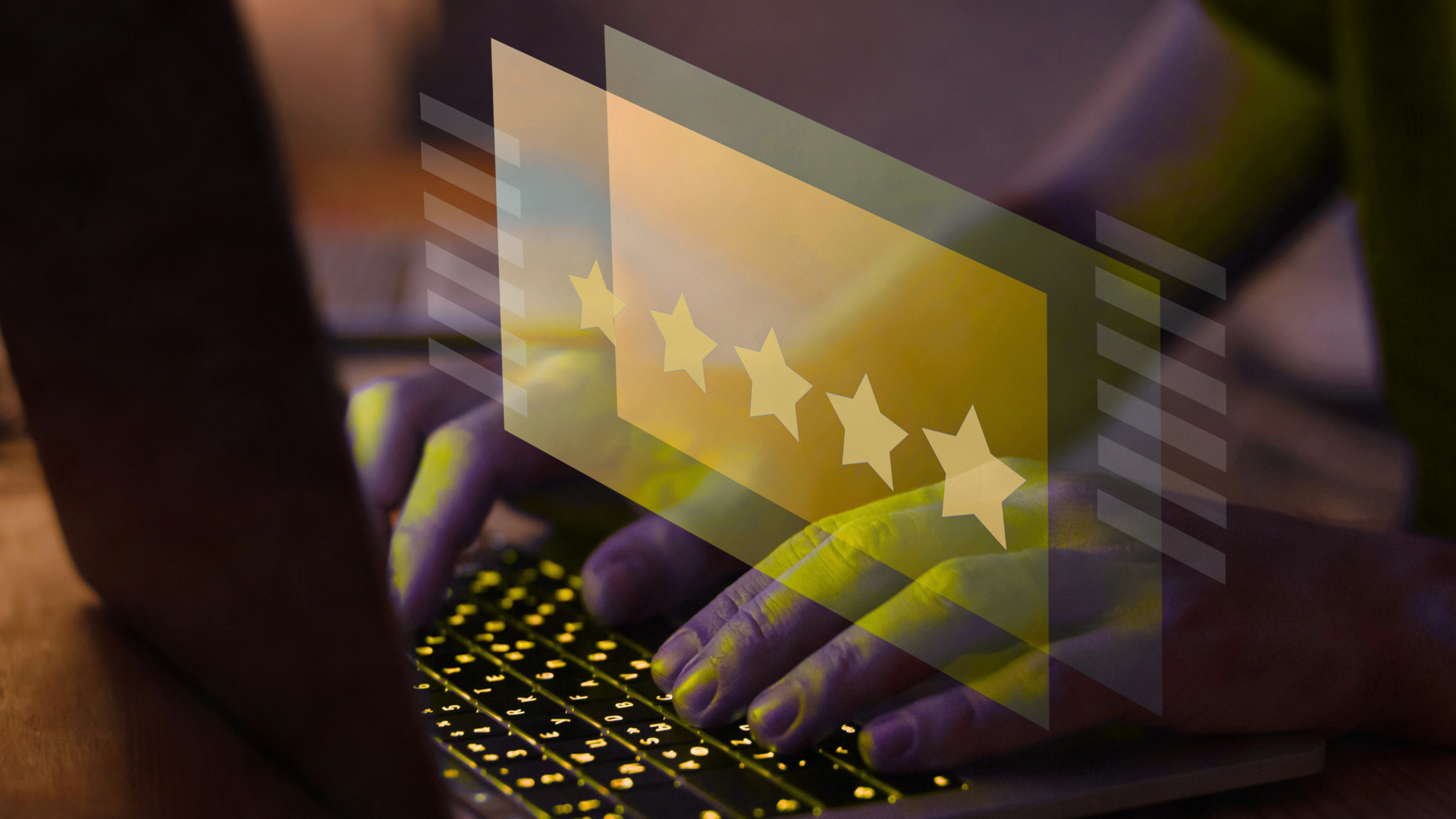 A person is typing on a laptop computer with a five star rating coming out of the screen.