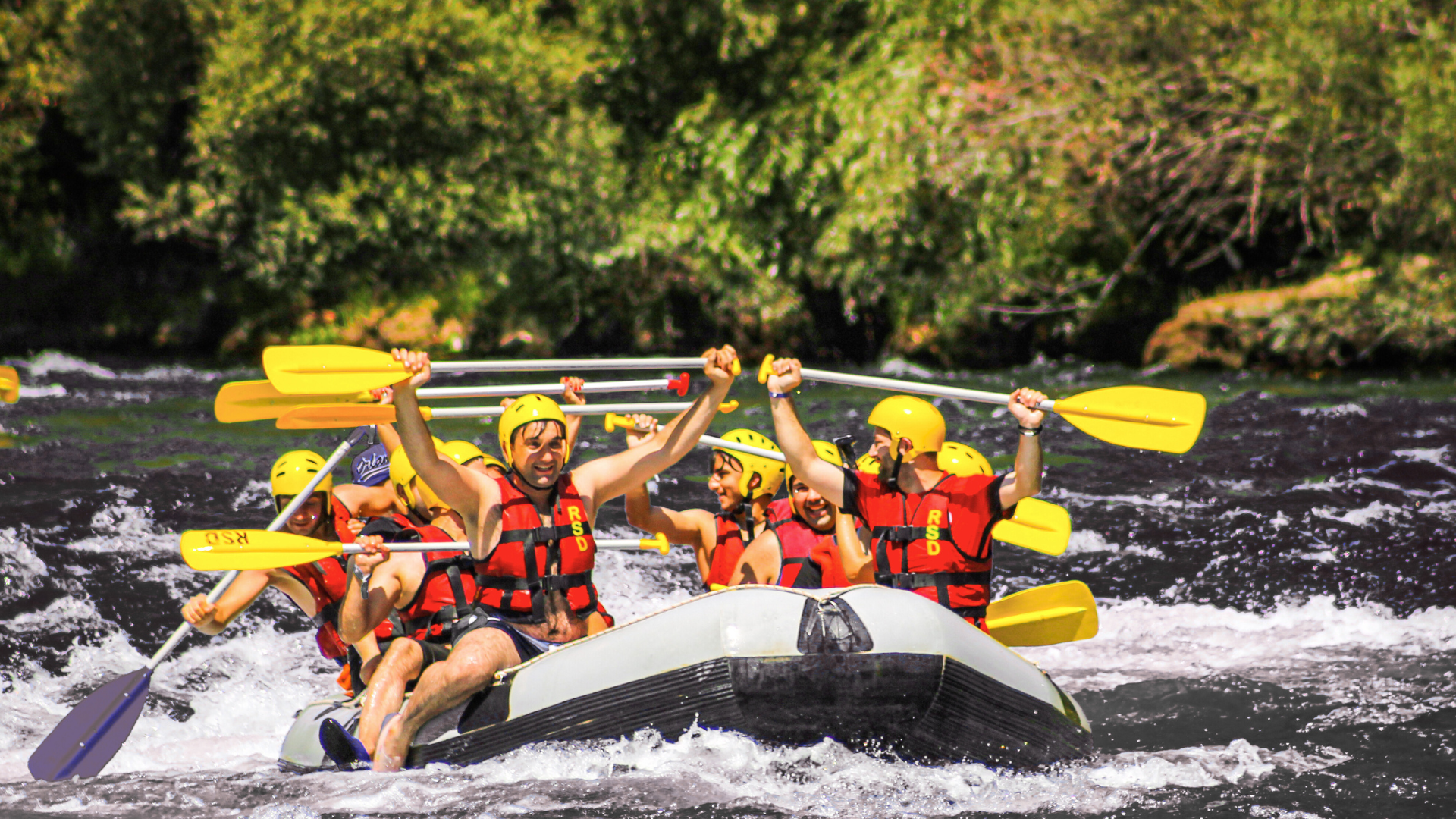A group of people are rafting down a river.