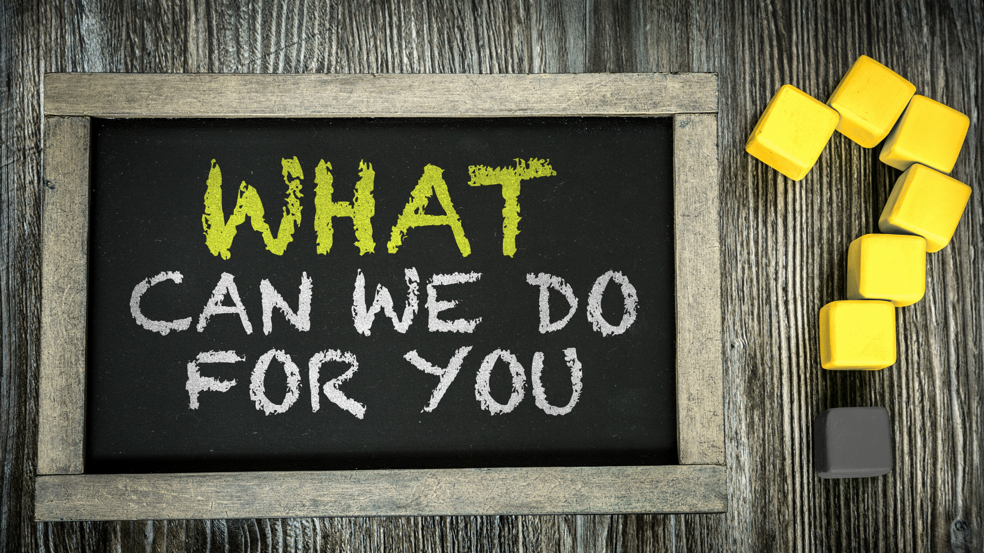 A blackboard with the words what can we do for you written on it