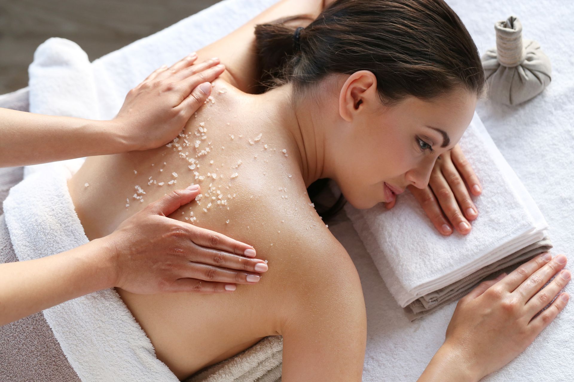 A woman is getting a massage at a spa.