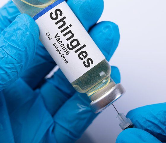 Doctor Filling Shingles Vaccine Syringe — Crete, NE — Ken's Pharmacy