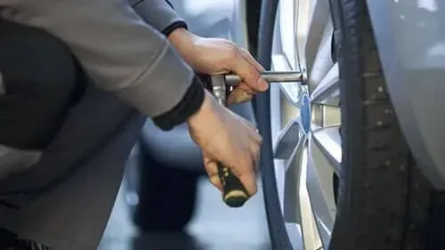 A mechanic working on a vehicle | Mohrs Automotive FL