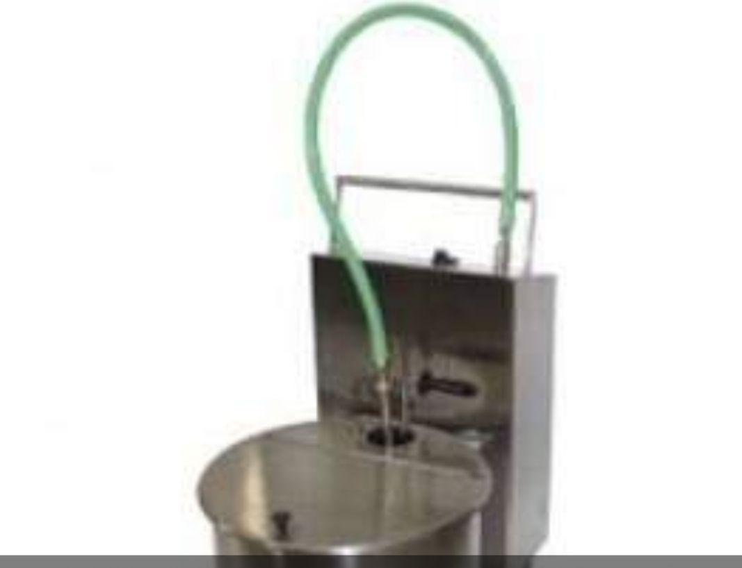 A bucket with a green hose attached to it