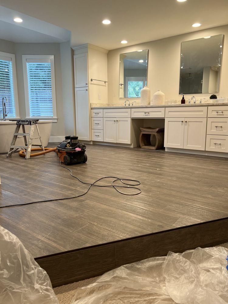 Construction scene: scaffolding, ladders, and building with new siding. Construction scene: scaffolding, ladders, and building with new siding.