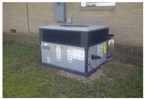 HVAC unit on top of grass and dirt — Polkton, NC — Austin's Mechanical Service, Inc