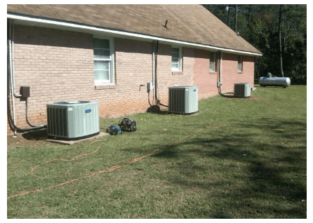 Multiple HVAC units next to brick house — Polkton, NC — Austin's Mechanical Service, Inc