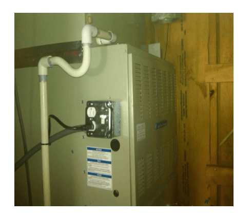 HVAC unit next to wooden walls — Polkton, NC — Austin's Mechanical Service, Inc