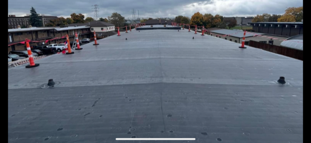 A roof with a lot of orange cones on it