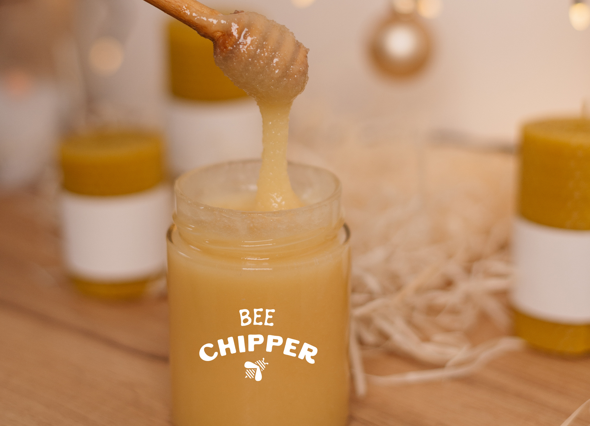 Honey dripping from a honey dipper into a jar, 
