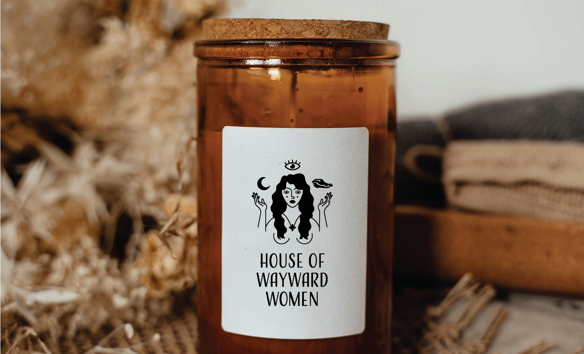 Brown glass jar with white label, black illustration of a woman, 