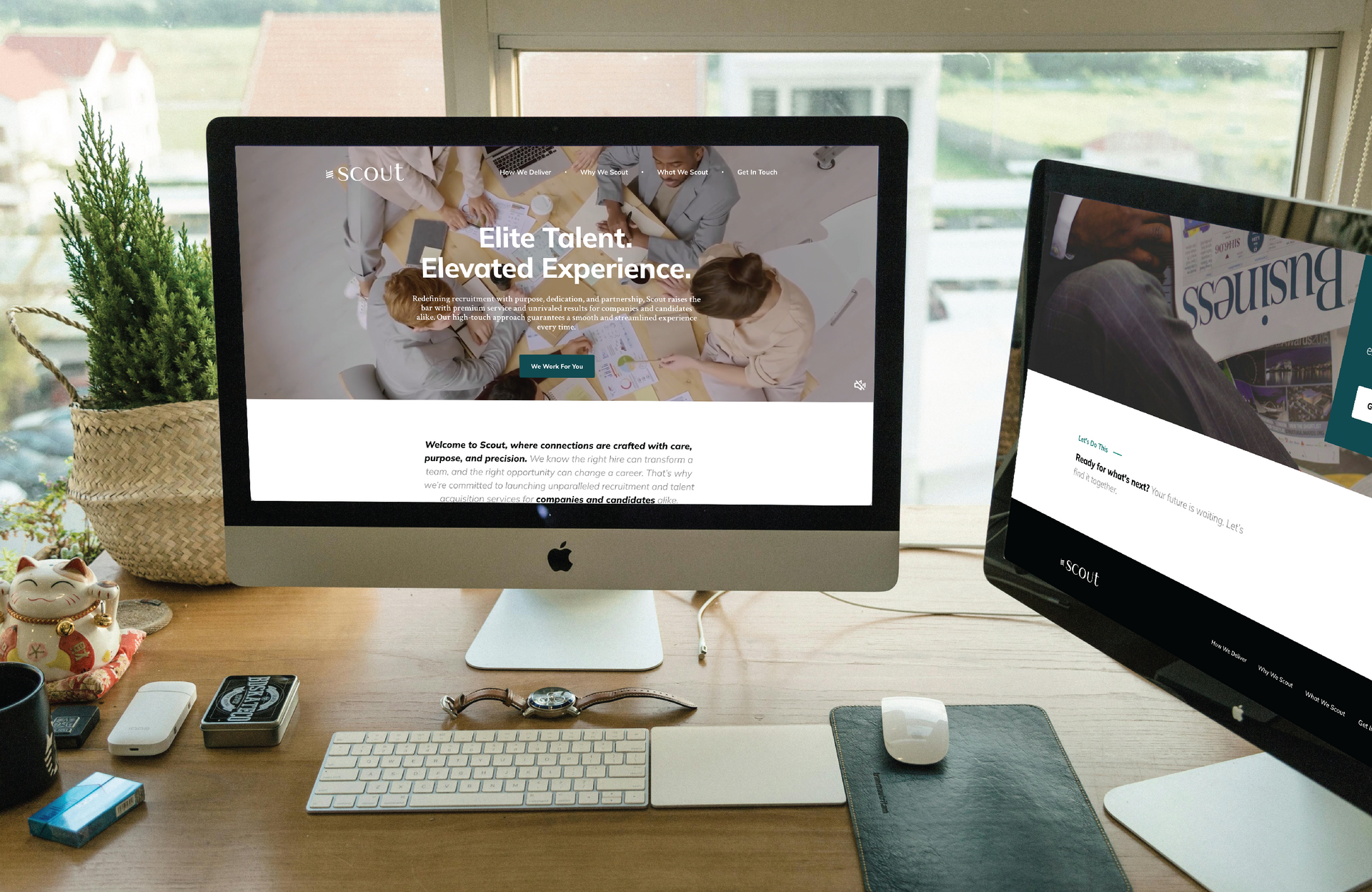 Two computer screens on a desk, one with Scout's website homepage, the other with a website page.