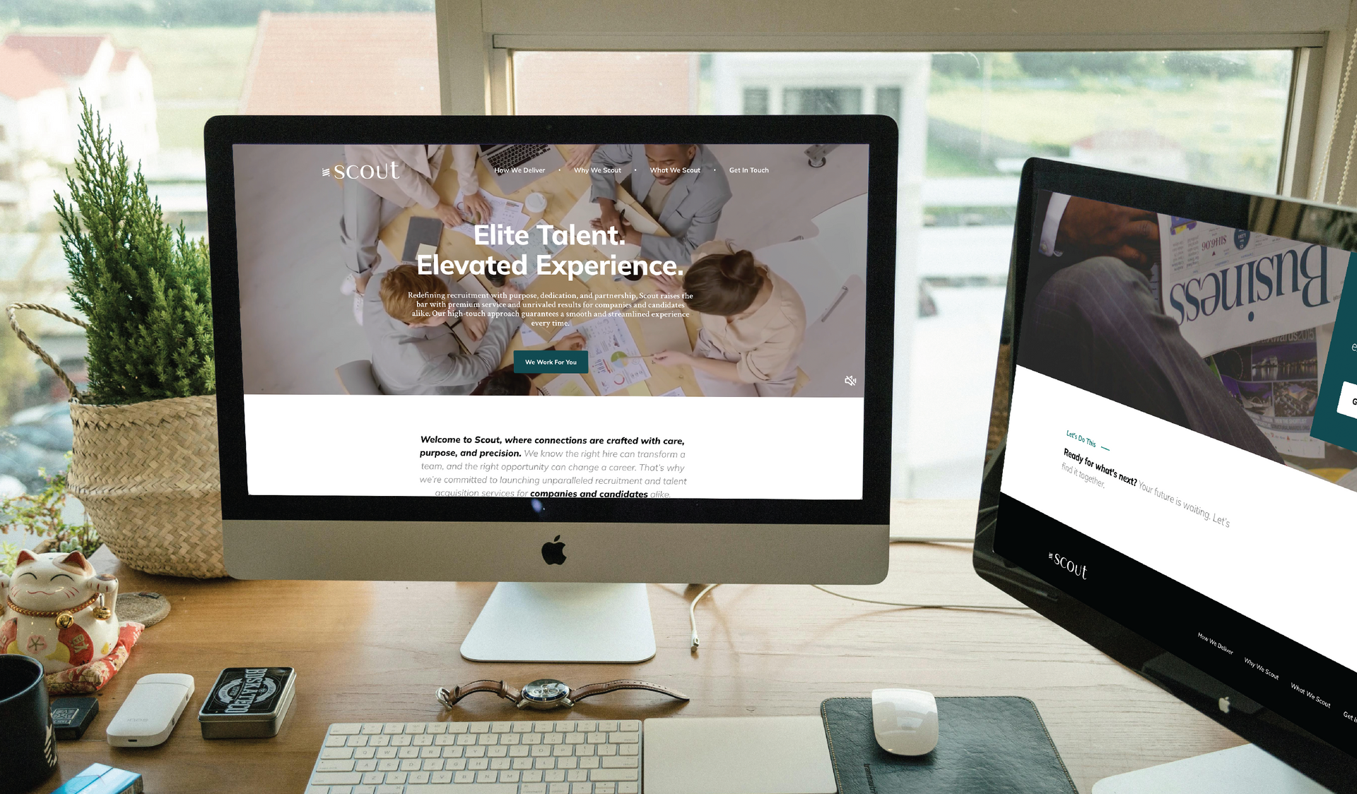 Two computer screens on a desk, displaying Scout's homepage.