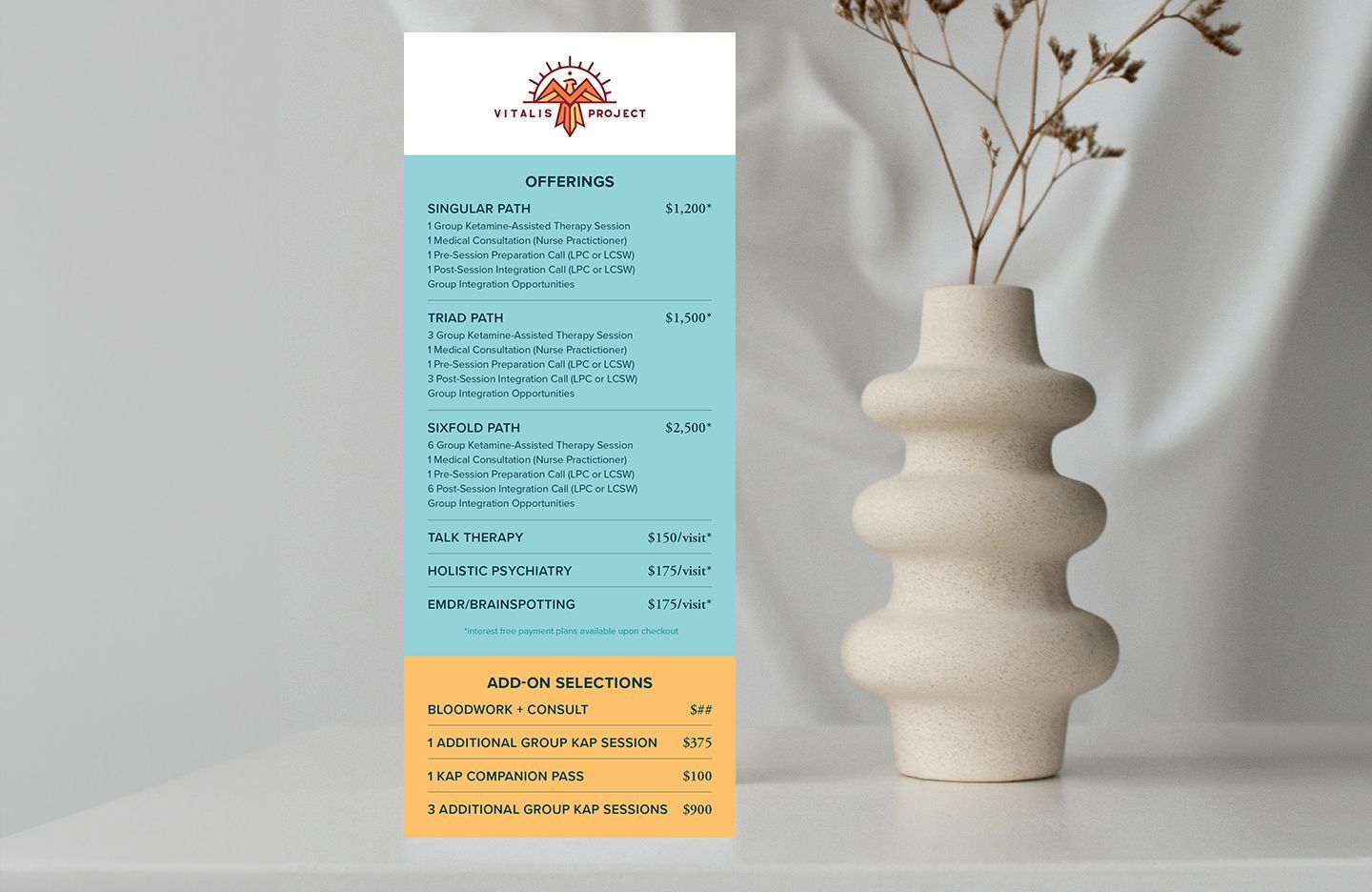 Vitalis Project's service menu with turquoise and gold sections, beside a vase with dried flowers.