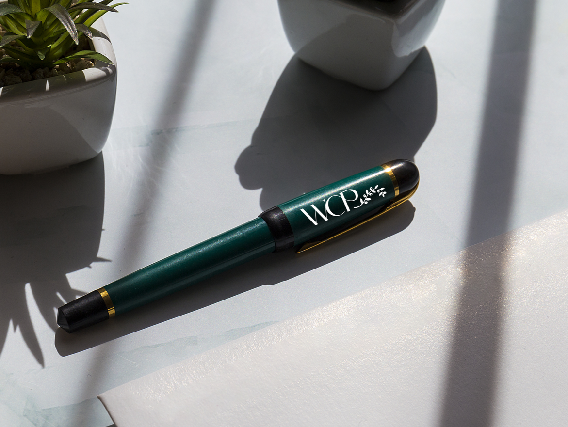 Green pen with gold accents, 