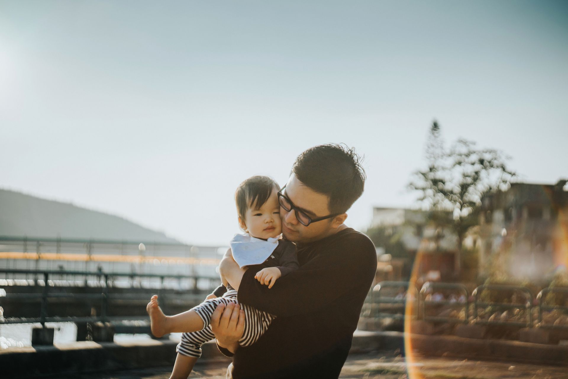 Father Carrying Baby — Fort Myers, FL — Rubinstein & Holz P.A.