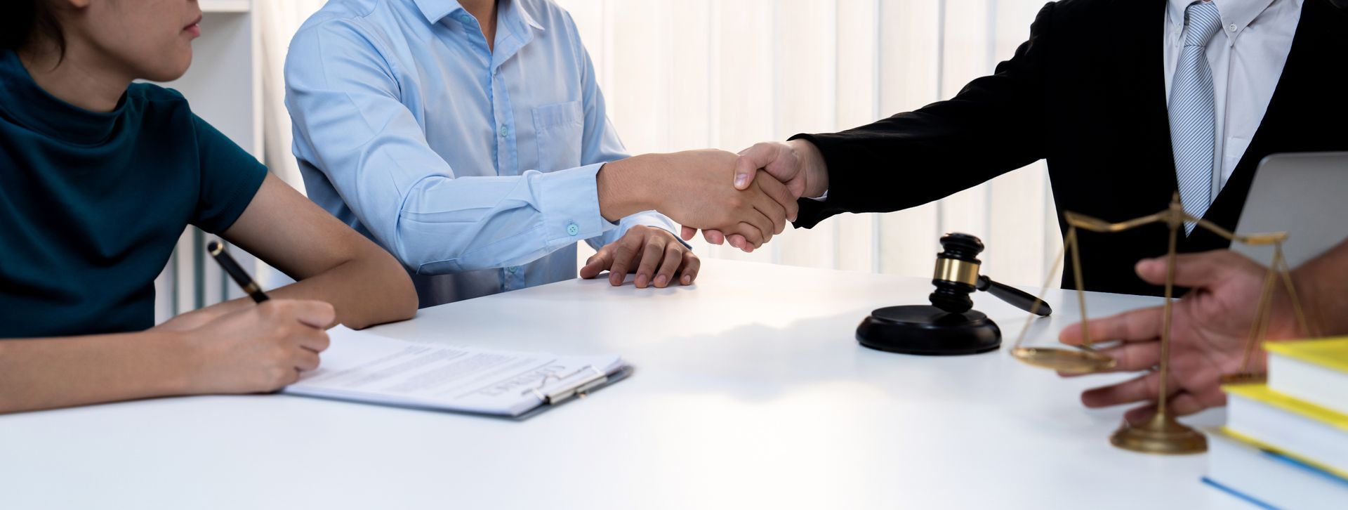 A couple consulting a family law lawyer about alimony and divorce options. A couple consulting a family law lawyer about alimony and divorce options.