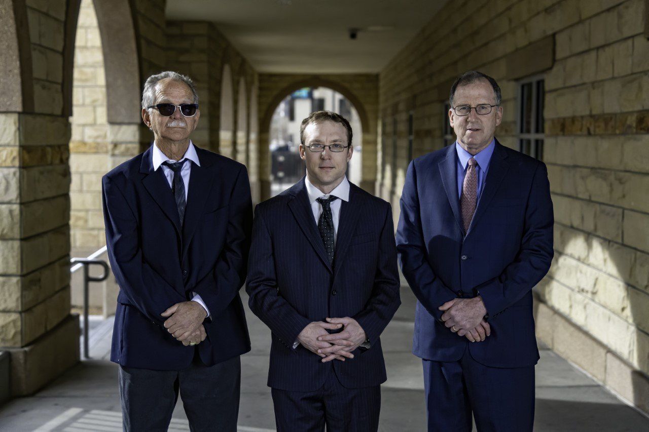 Attorneys In Front Of Law Firm Building — Albuquerque, NM — Duhigg, Cronin, Spring & Berlin