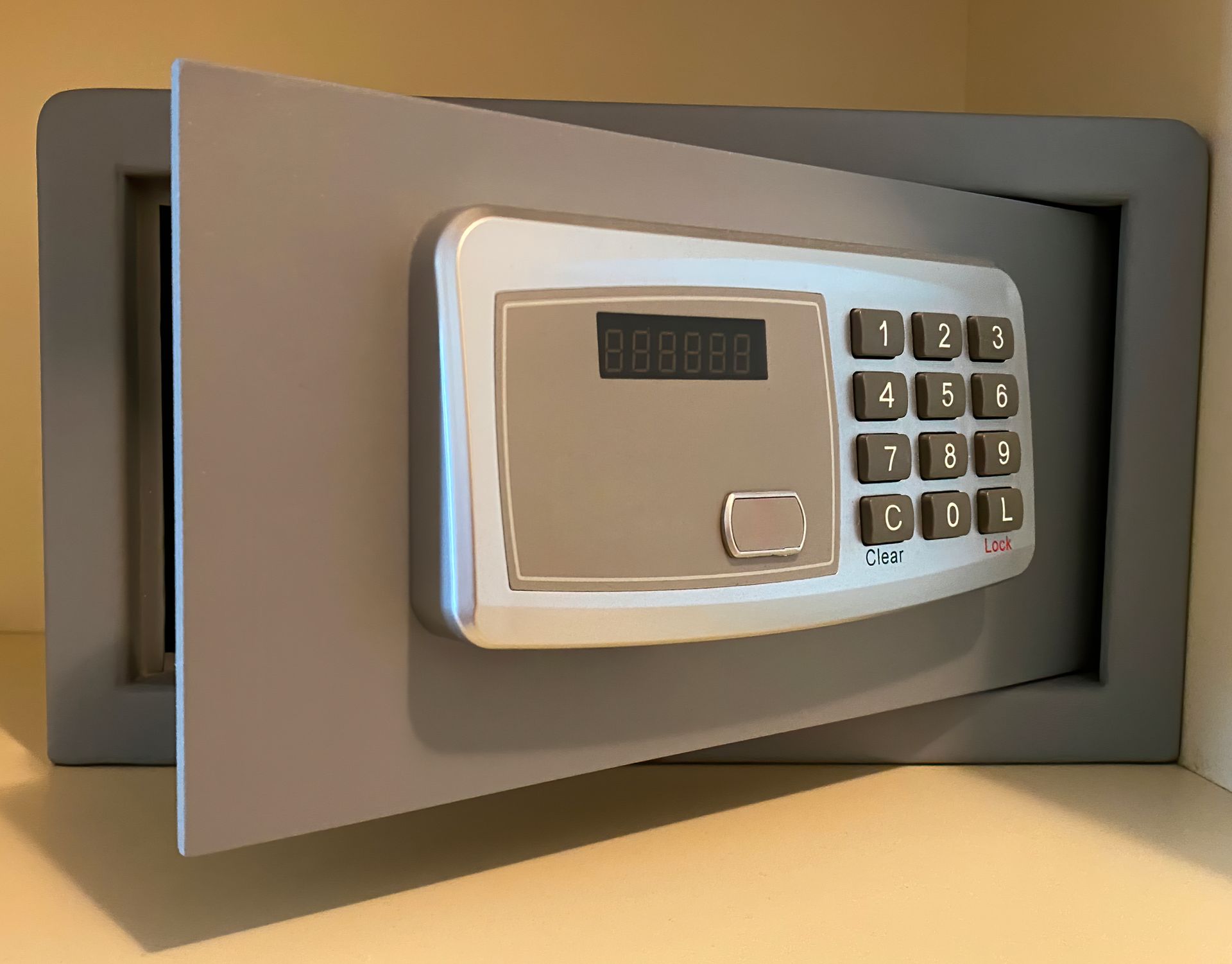 A person is holding a car key in their hand in a car.