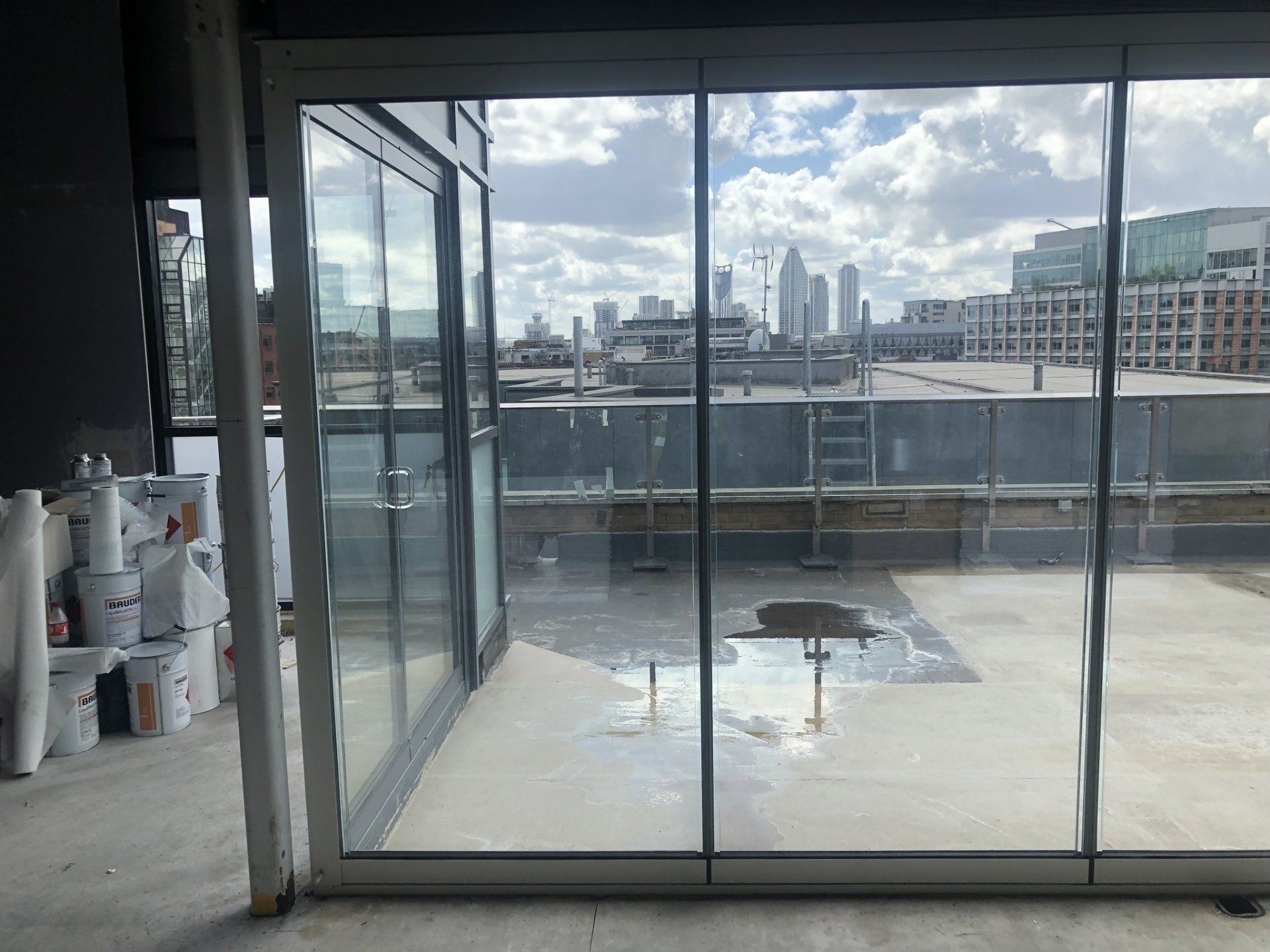 There is a view of the city through the sliding glass doors.