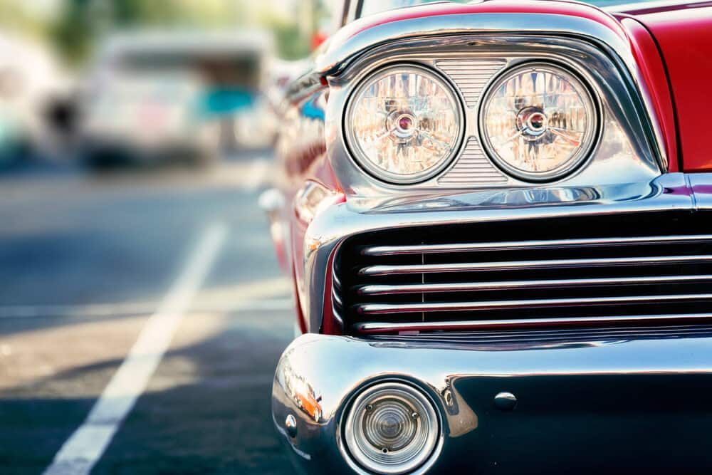 A Close Up Of The Front Of An Old Red Car Parked On The Side Of The Road — Twin City Auto Dismantlers In Wangaratta, NSW