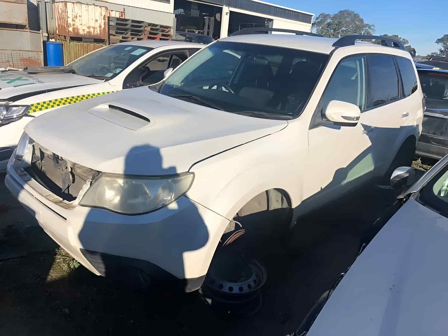 A White Subaru Forester SUV, Parked In An Outdoor Salvage
