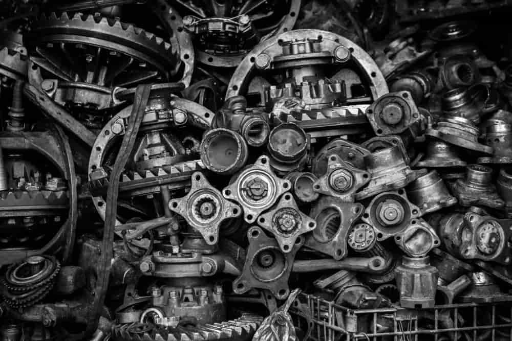 A Black And White Photo Of A Pile Of Metal Parts — Twin City Auto Dismantlers In Wodonga, VIC