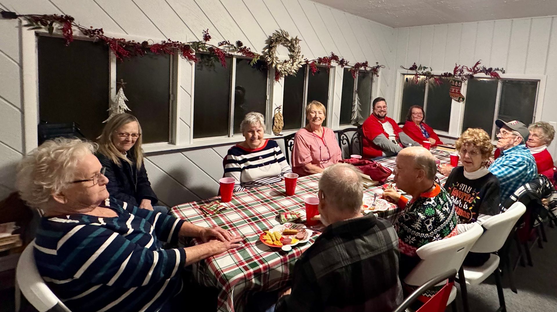The inside of a church with a cross and a projector screen