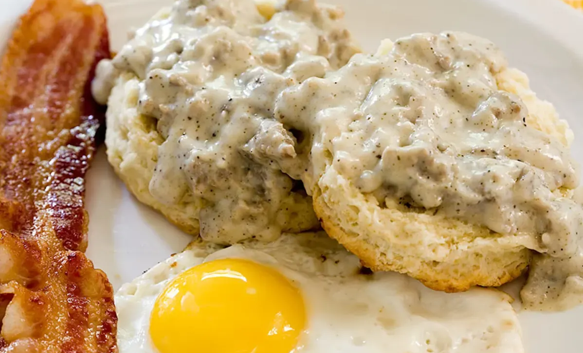The inside of a church with a cross and a projector screen