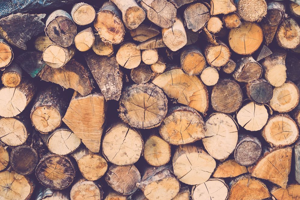 Pile of Stacked Firewood Logs — Tenterfield Timber & Hardware in Tenterfield, NSW