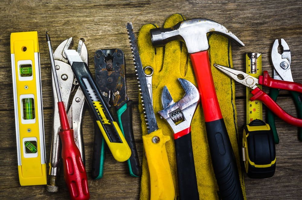 A Bunch Of Tools Are Sitting On A Wooden Table  — Tenterfield Timber & Hardware in Glen Innes, NSW