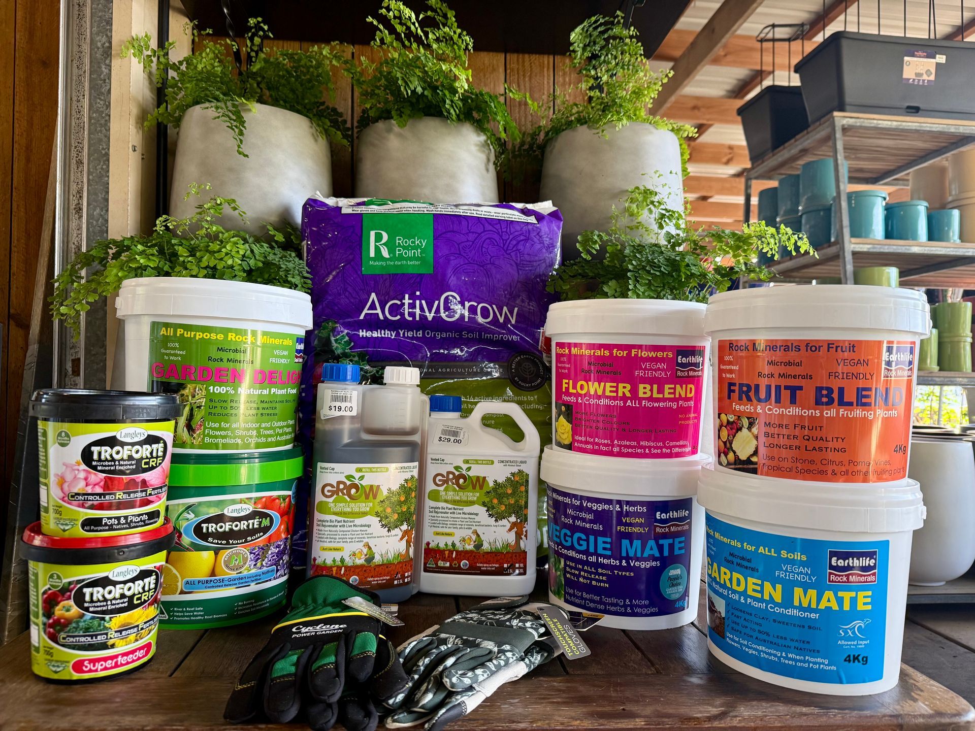 A group of green containers sitting next to each other on a wooden table.