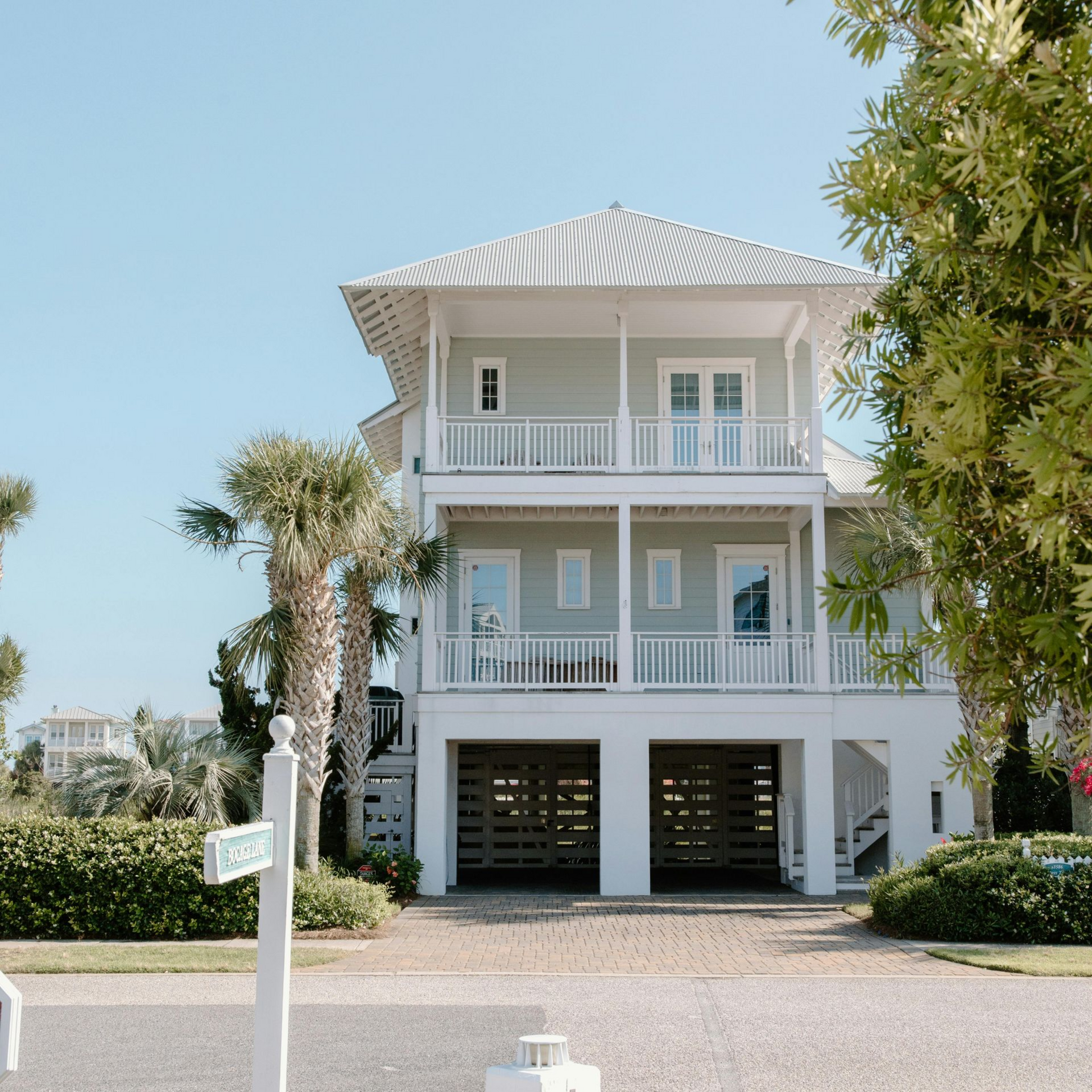 A brick building with a palm tree in front of it