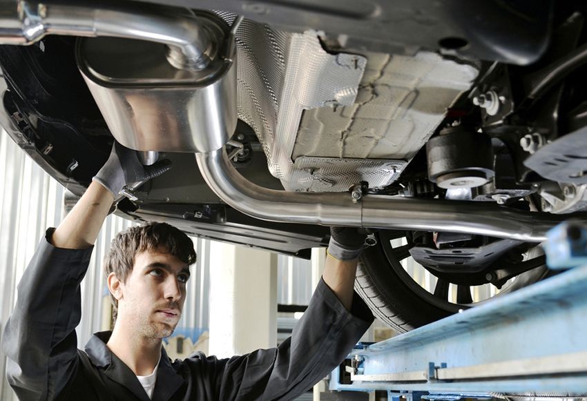A Man is Working on the Underside of a Car — Regen NT in Holtze, NT