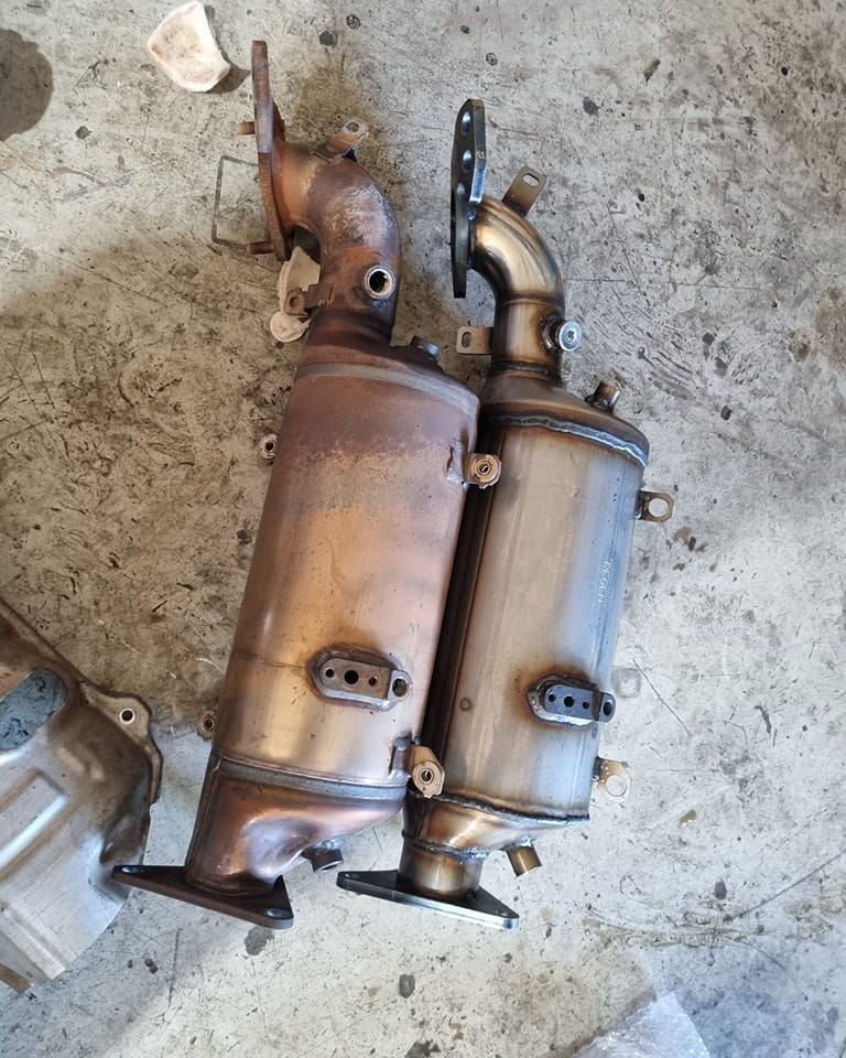 A Couple of Exhaust Pipes Sitting on Top of a Concrete Floor — Regen NT In Holtze, NT