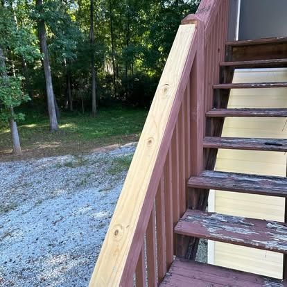 A wooden staircase with a wooden railing and steps.