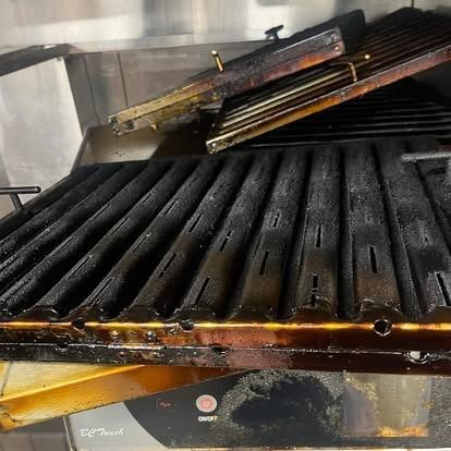 The grill is very dirty and needs to be cleaned.