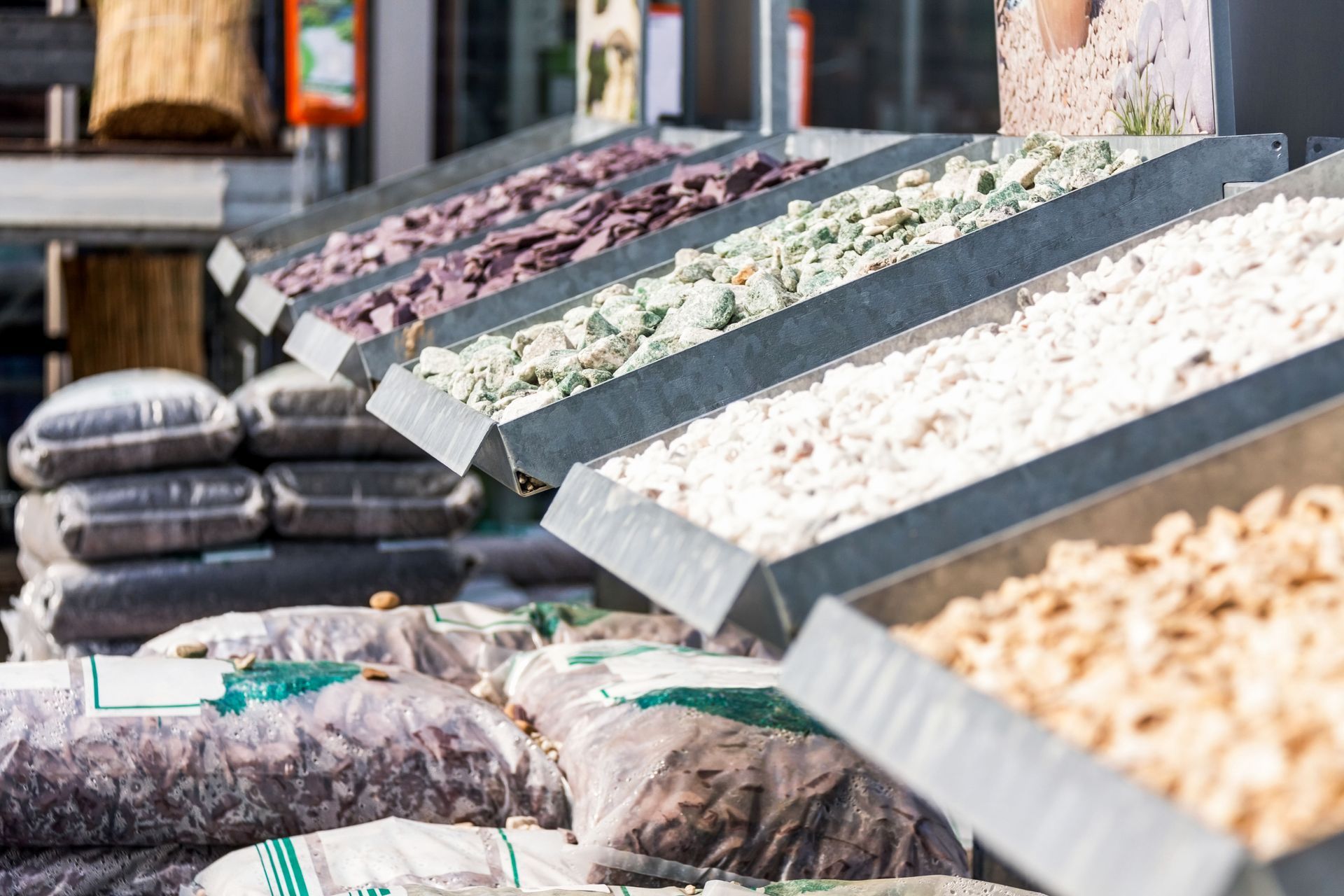 Modern landscape with white river stones, lush green grass, and grey pavers. Landscaping ideas. Modern landscape with white river stones, lush green grass, and grey pavers. Landscaping ideas.