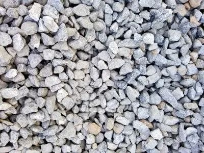 Gray gravel, small and irregularly shaped, covers the ground.