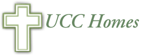 A logo for ucc homes with a cross in the middle