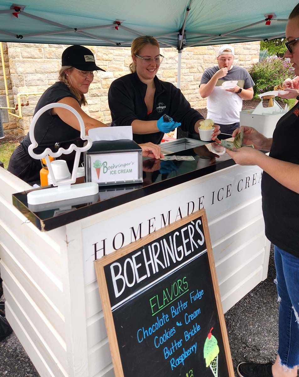 A homemade ice cream stand with a sign that says boehringer 's