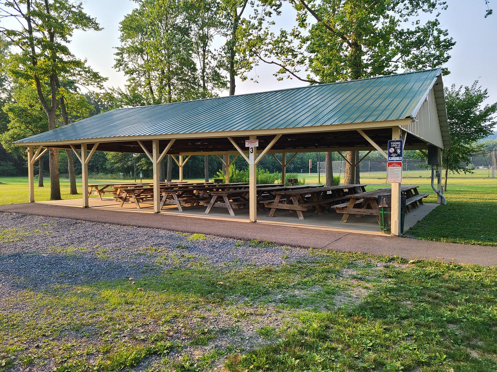 A picnic shelter with a sign that says no dogs