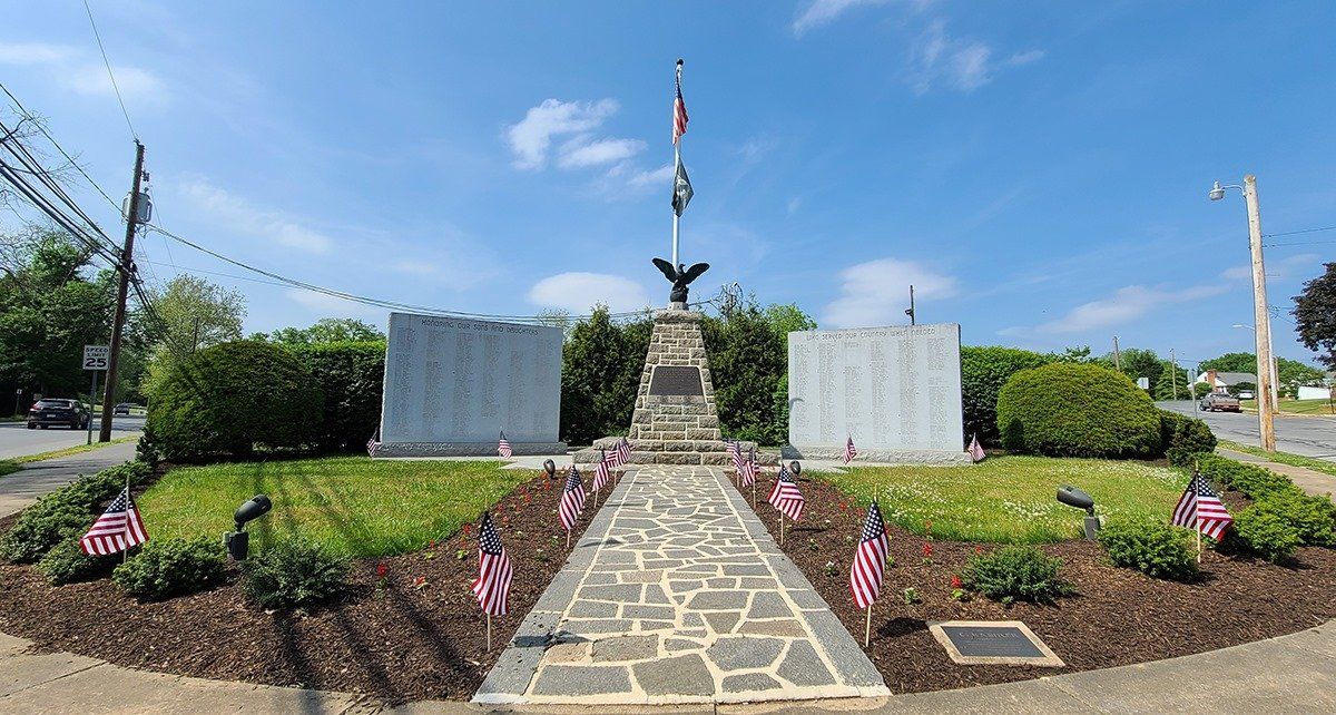 A memorial with an eagle on top of it