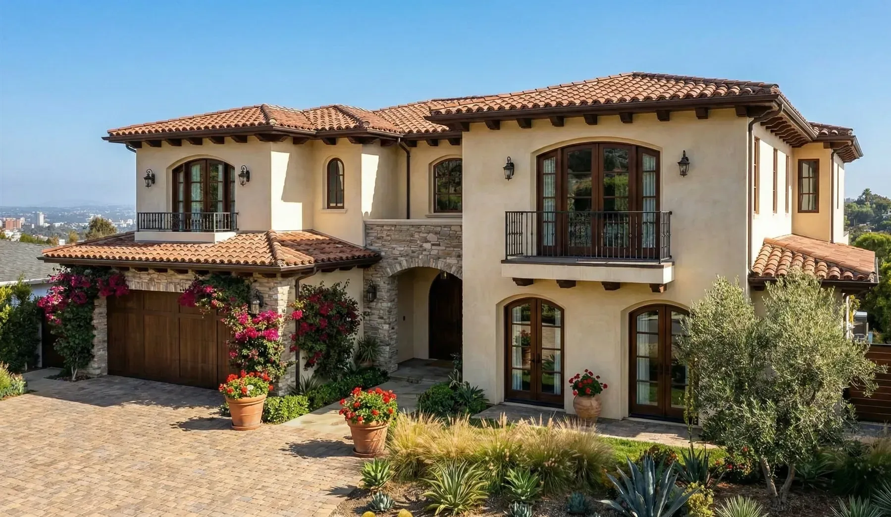 A white house with a white picket fence and a porch