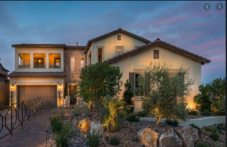 A large house with a lot of trees in front of it