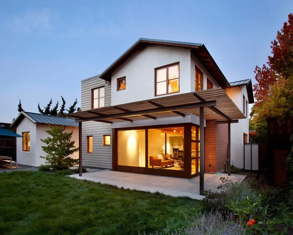 A house with a pergola and a lot of windows