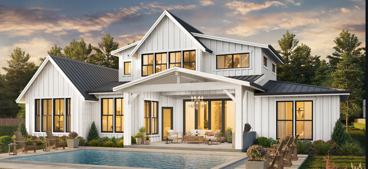 A large white house with a swimming pool in front of it.