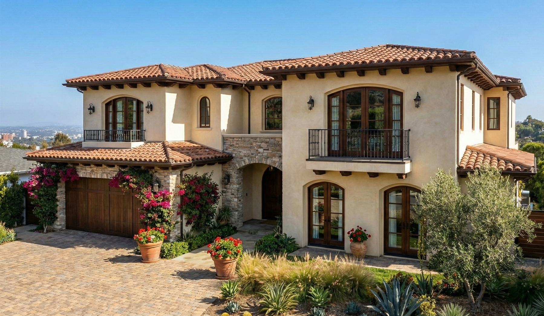 A white house with a white picket fence and a porch