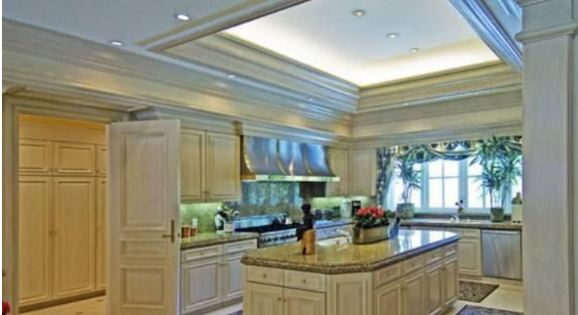 A kitchen with a large island in the middle of it