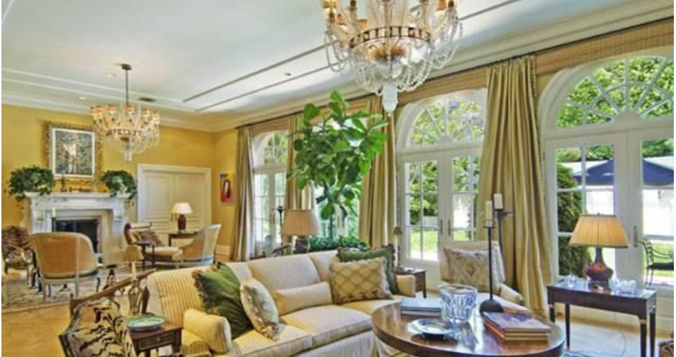 A living room filled with furniture and a chandelier