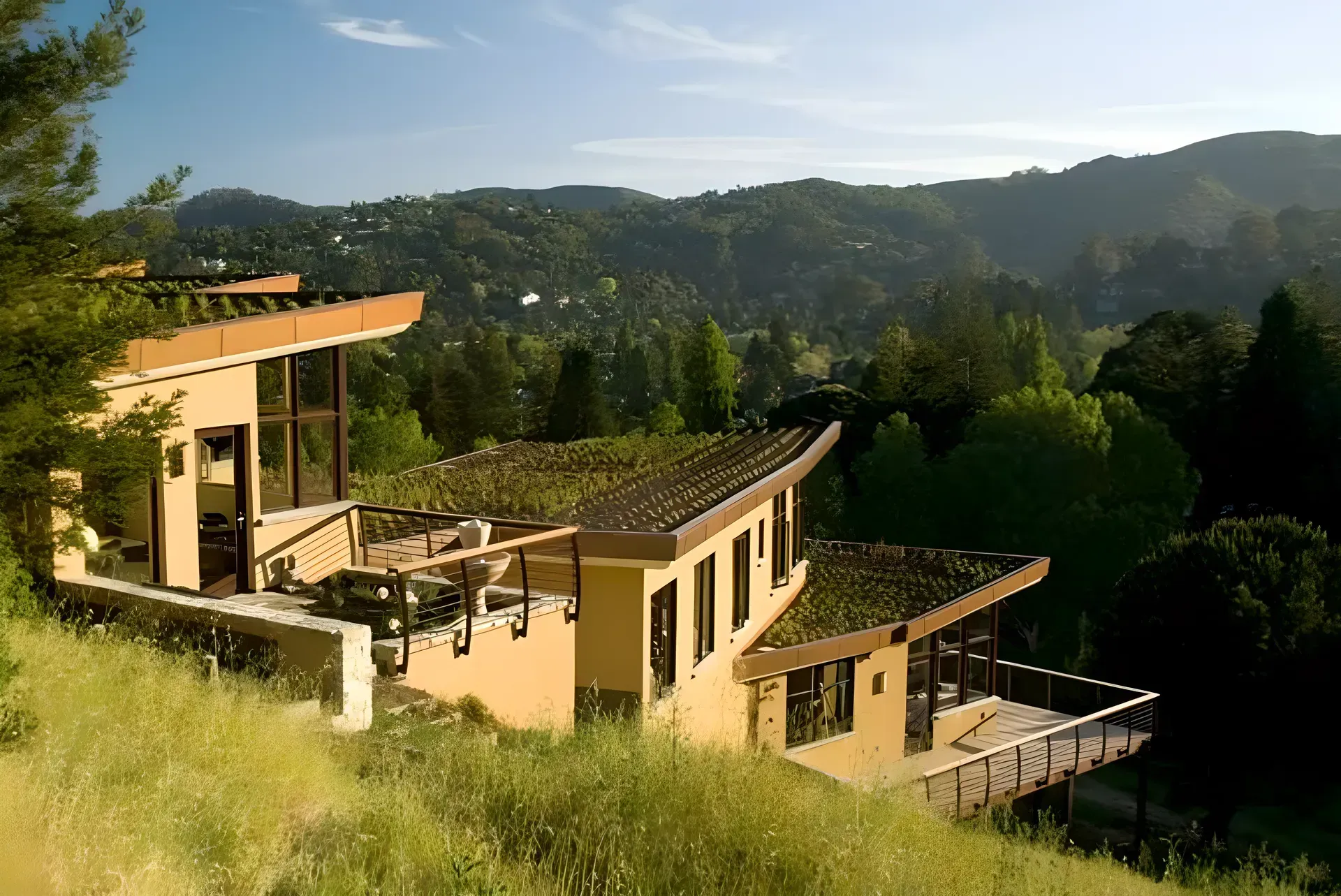 A house on a hill with a green roof